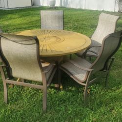 Wooden Table With Rotating Center. 5 Clean Chairs 