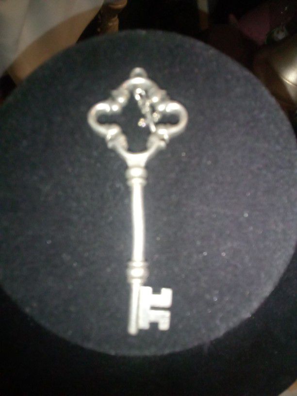 A Key Lock With Cross Jewelry 