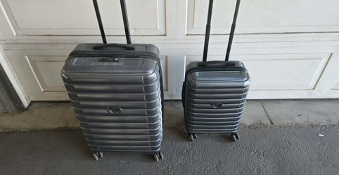 DELSEY LUGGAGE SET HAVE IN GREEN AND GRAY SELLS AT COSTCO FOR 180