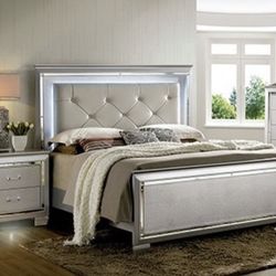 button tufted headboard adds a charming effect. The headboard, mirror, and night stand have built-in LED lights to illuminate the mood.