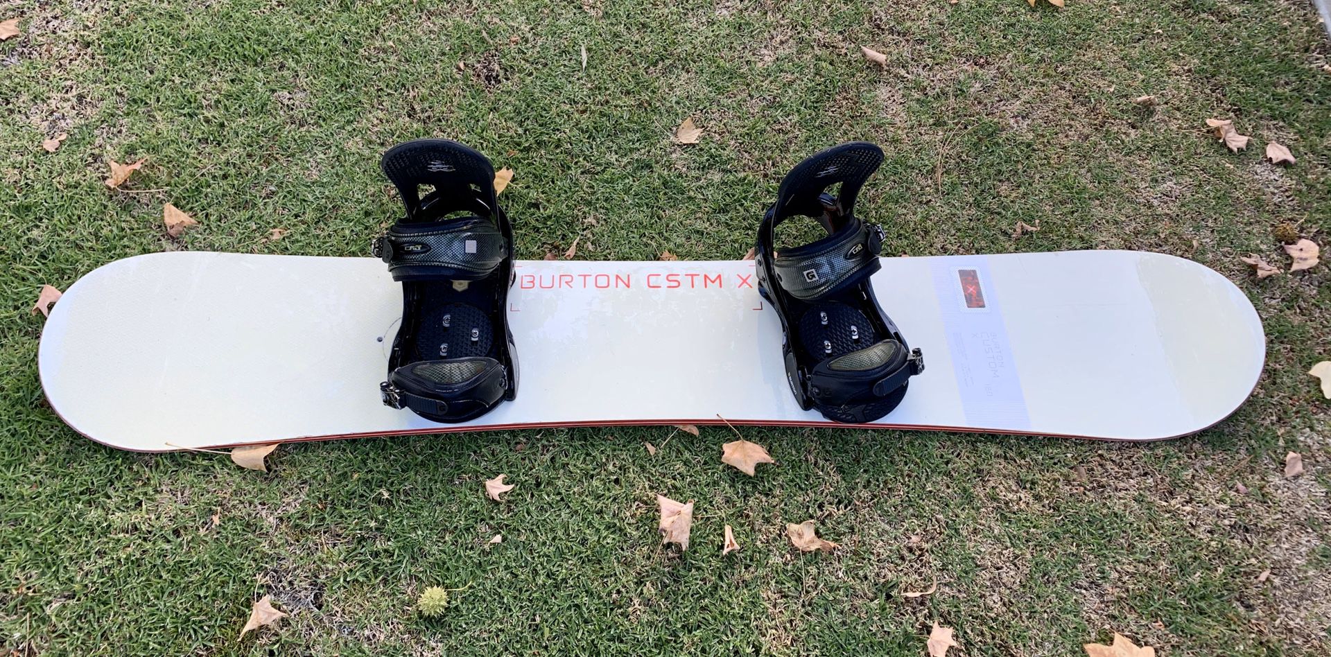 Burton Custom X snowboard with Burton bindings and board cover