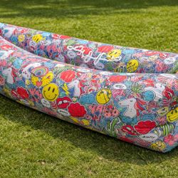 Festival Inflatable Couch - brand new - used once.  Colorful, lightweight air lounger. Fills with air in seconds. Perfect for outdoor events or chill 