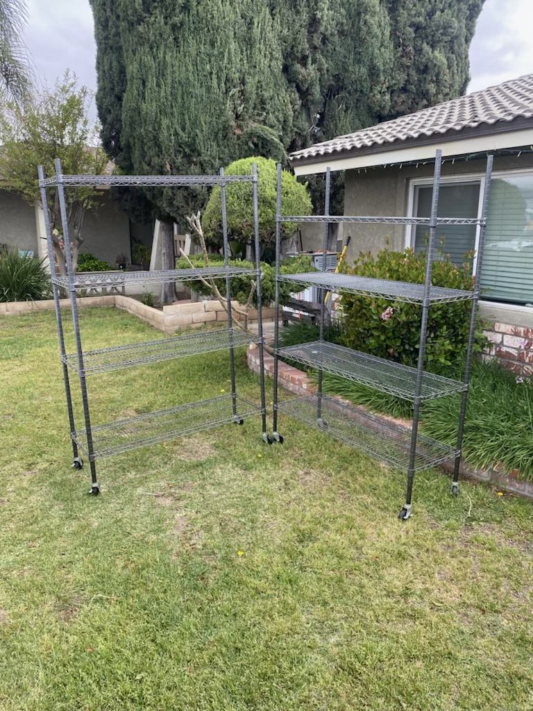 Metal Racks With Wheels 2 units Available asking $150 for both