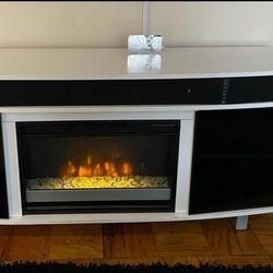 TV Stand With Fire Place And A Bluetooth Sound