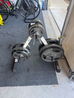 Fitness Gear 300lb Olympic Weight set with rack. 45lb bar.