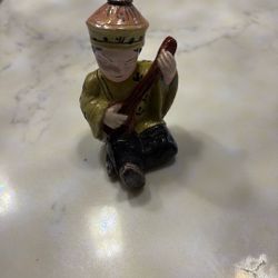 Vintage Japanese boy playing an instrument