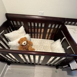 Free crib  with mattress and changing pad