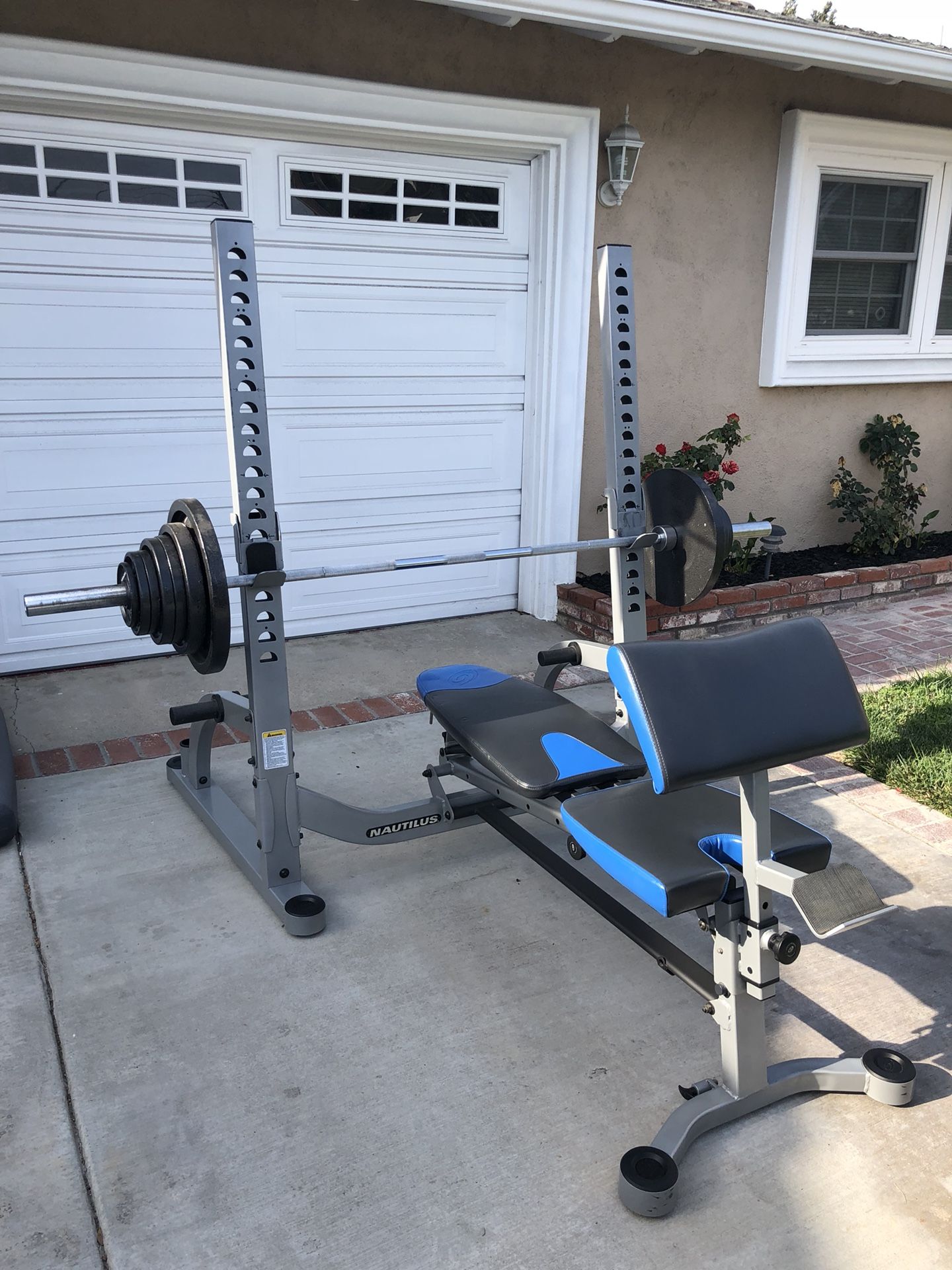 Nautilus Folding Olympic Bench with 249 Lbs Total Weights