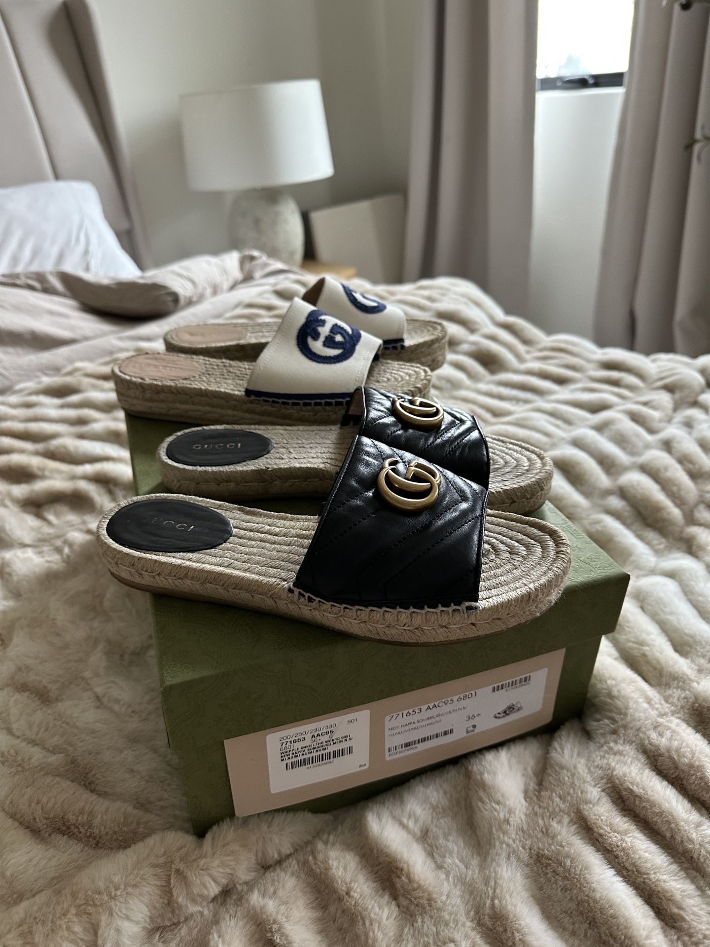 Two pair of Gucci slides