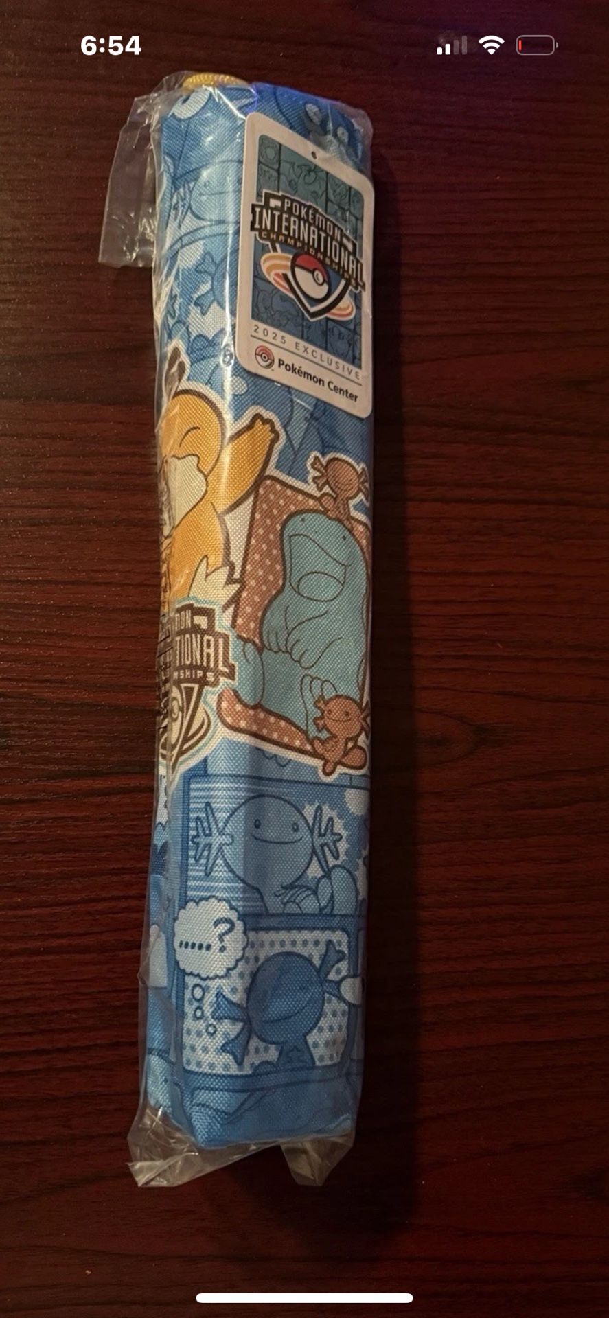 Pokémon TCG NAIC 2025 Psyduck playmat and cover.