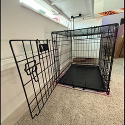 medium-sized black metal dog crate 