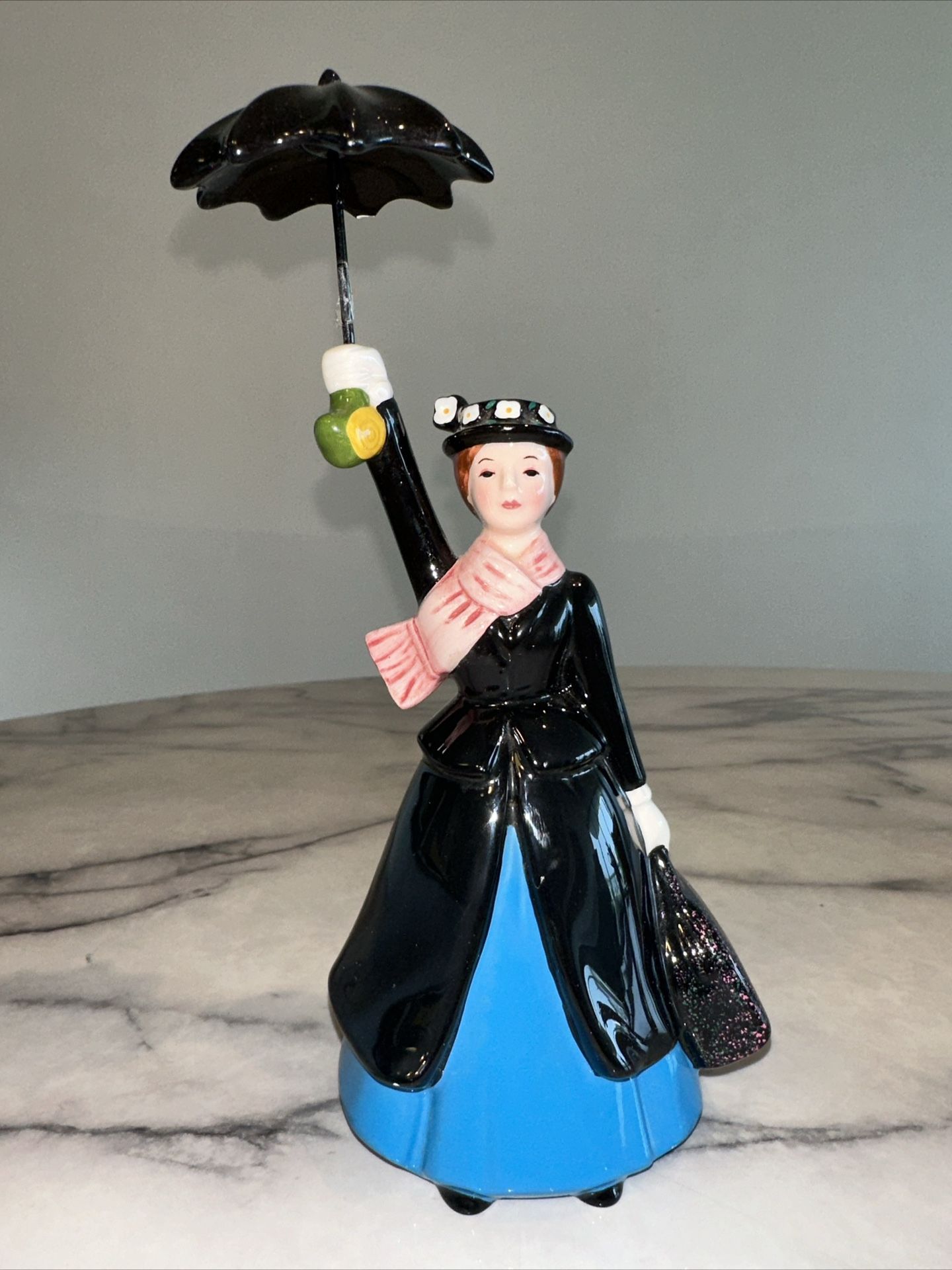  RARE Disney Store Mary Poppins Ceramic Figurine W/ Umbrella Vintage 8"    This is old. It's rare to find mary poppins Disney items these days. The um