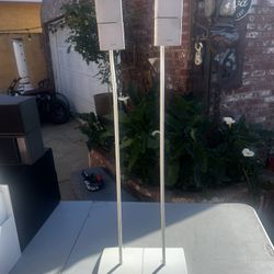 Bose Jewel Cube speakers mounted on floor stands