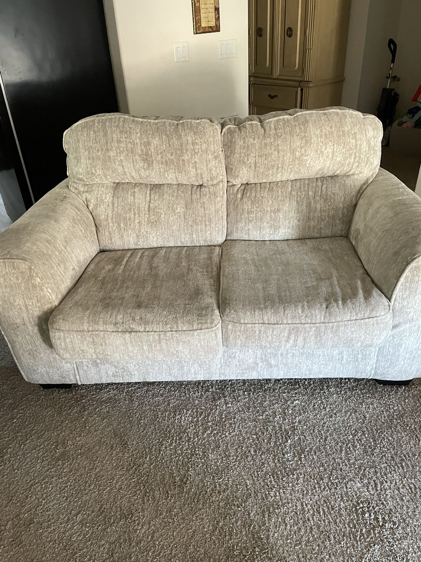 Loveseat And A Chair With Footstool