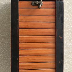 Antique-style wooden wine storage box with metal latch and handle.