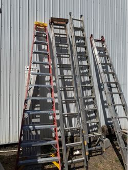 12 ft. fiberglass step ladder in good used working condition. Heavy-duty commercial ladder with normal wear from job-site use.