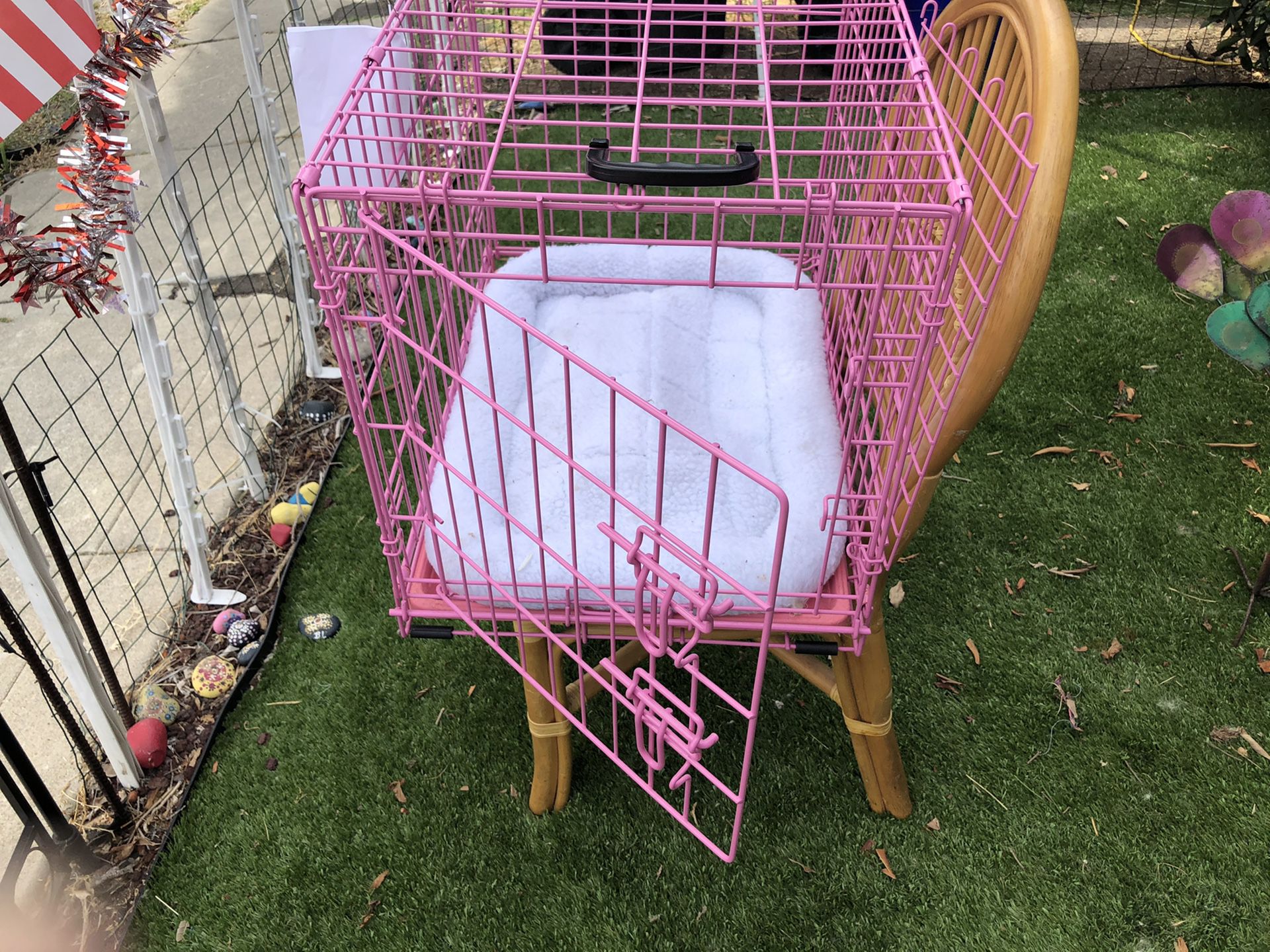 Pink dog crate 24 inches long 17 inches wide 18 inches