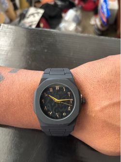 Black and gold watch