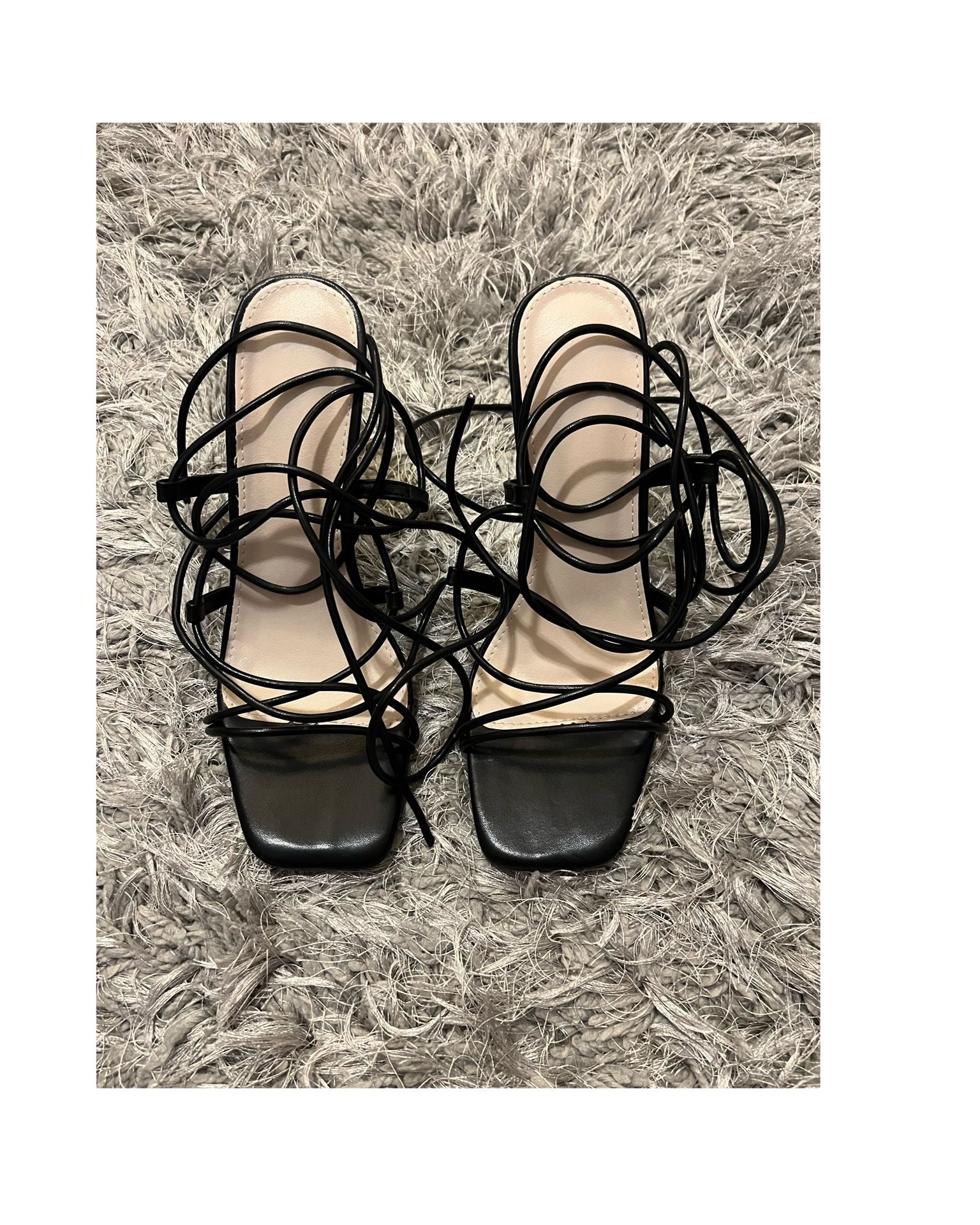 Tie leg design clear pyramid heeled Gladiator sandals In Black