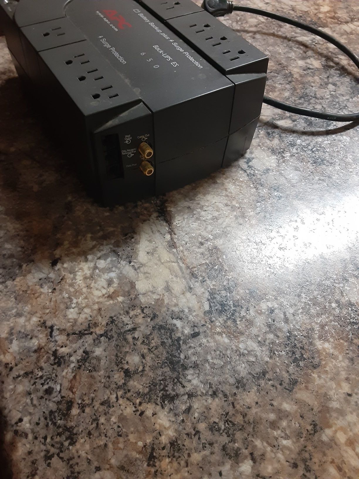 Battery backup surge protector