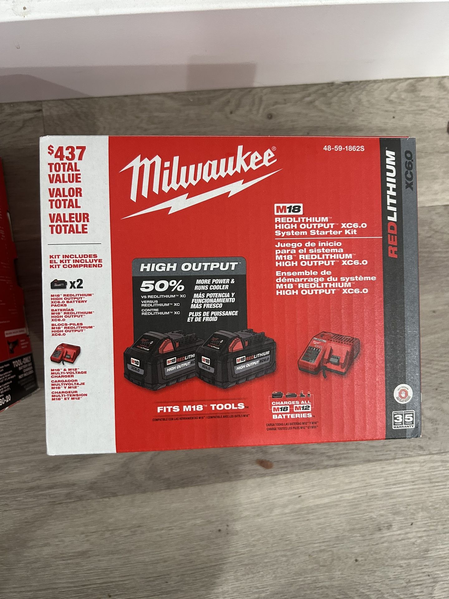 brad new Red lithium high output xc6.0 Milwaukee comes with 2 batteriesand a charger