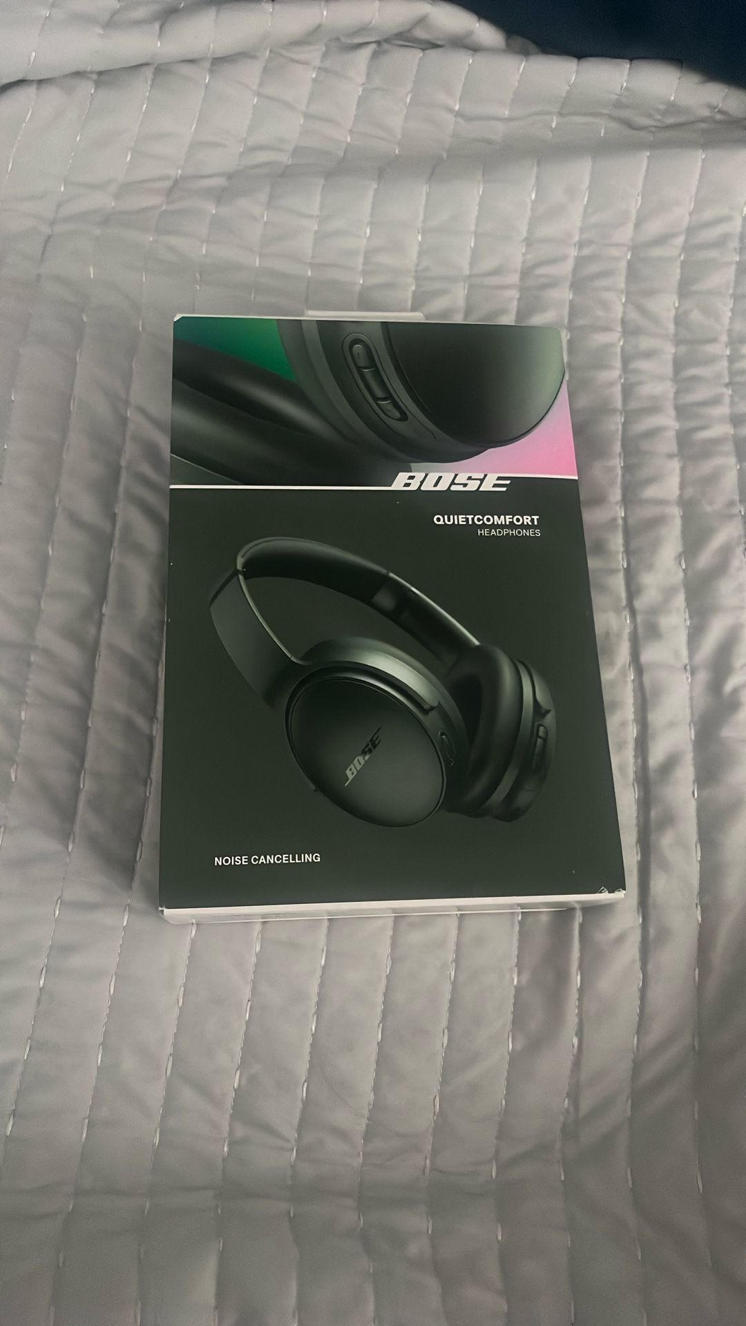 Green Bose Quiet Comfort headphones