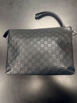 Gucci GG Embossed Leather Clutch Bag