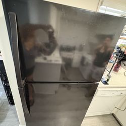 Black 18 cu ft. whirlpool refrigerator with top freezer