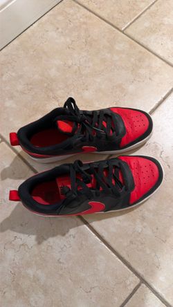 Black and red unisex Nikes