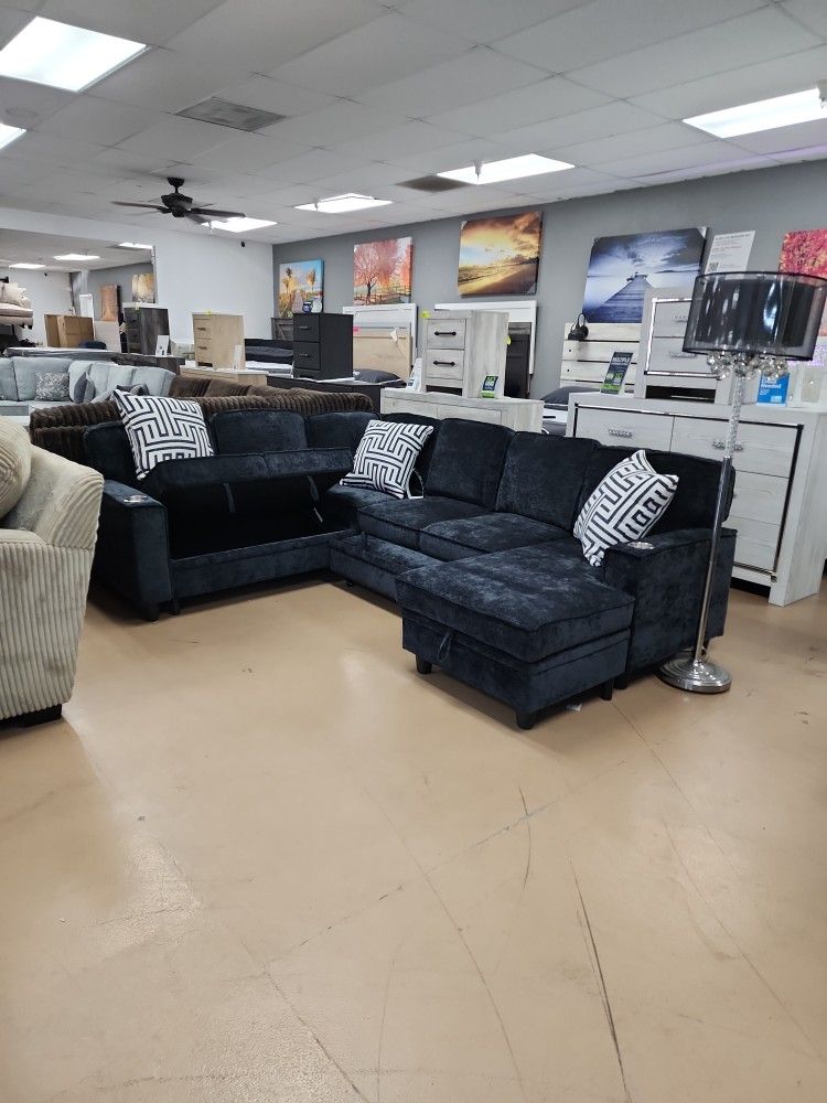 Charcoal Gray Sectional With Pop-up Sleeper Hidden Storage And USB Charging Ports With Cup Holders
