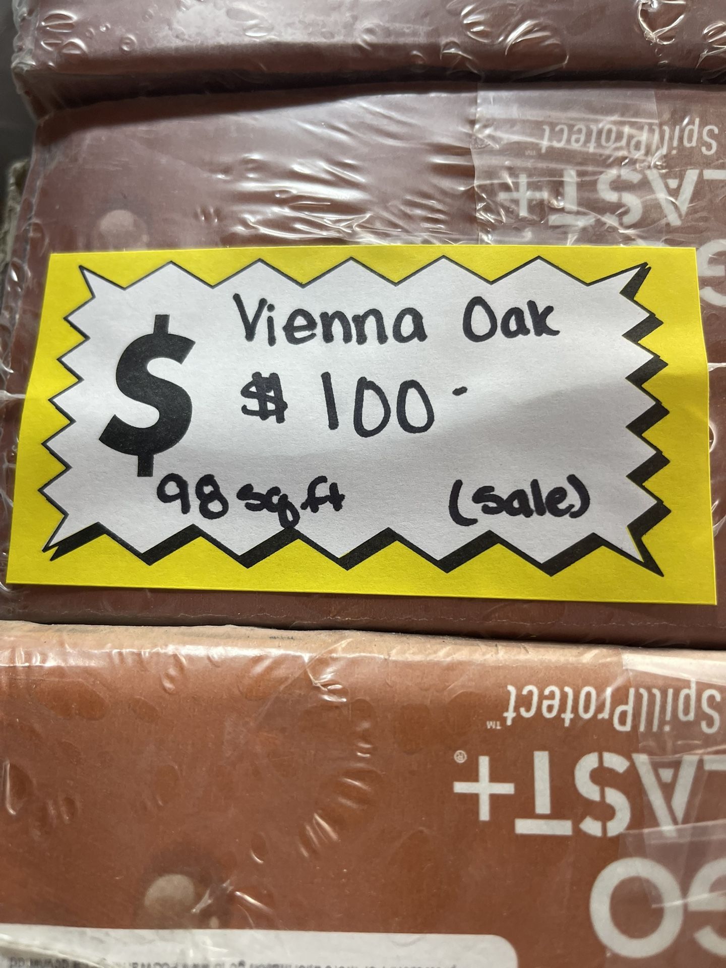 SALE - Vienna Oak 12 mm Tx 7.5 in. W Waterproof Laminate Wood Flooring