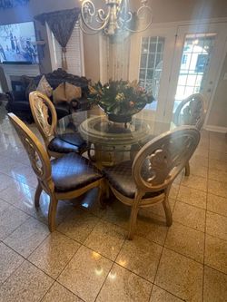 Glass table and five chairs for sale