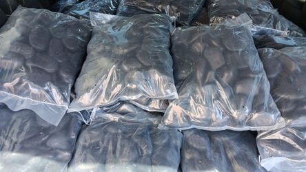 3"-4" black Polish landscaping rocks, 44 pound bags.