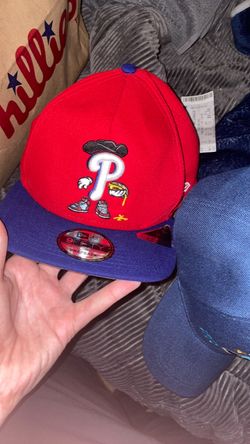 Two Phillies hats one red and blue one city connect