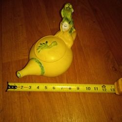 Tea Spot Yellow And Green With A Lady And The Animal On Her Head