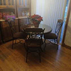 Kitchen Table With Glass Table Cover and 4 cushioned chairs