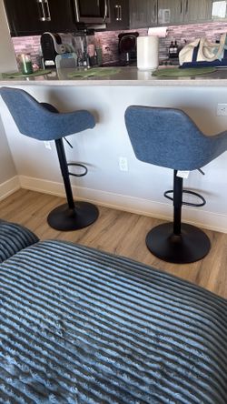 Two blue high chairs