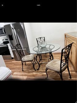 48” round beveled glass table with matching chairs