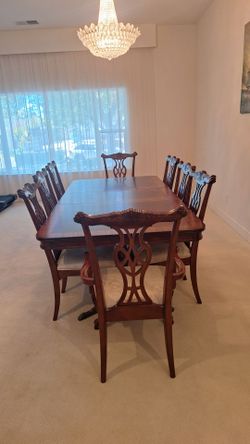 Wood dining table set and matching hutch