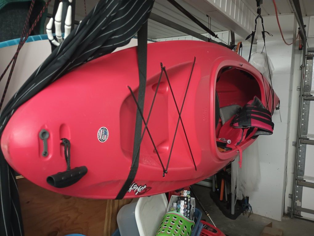 Three Kayaks With Paddles