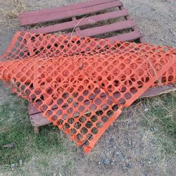 Orange plastic safety guardian barrier Construction fence