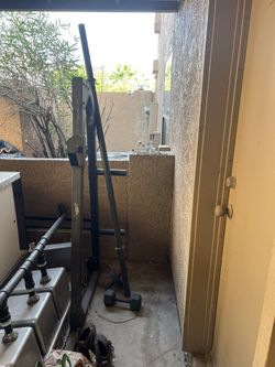 Barbell with a dumbell and ab roller for $35