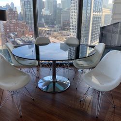 Mid-century tulip table. The top is oval smoky glass. (TABLE ONLY)