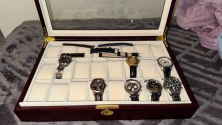 7 watches with case and extras