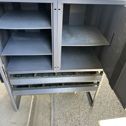 Lockable metal storage cabinet
