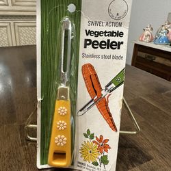 Vintage vegetable peeler, yellow handled with flour