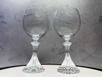 Set of (2) Mikasa The Ritz water goblets featuring a plain bowl and a distinctively textured, ribbed stem. Clear lead crystal with a prominent fluted,