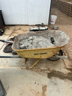Wheelbarrow with dried concrete in it FREE
