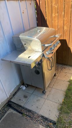 Grill with tank