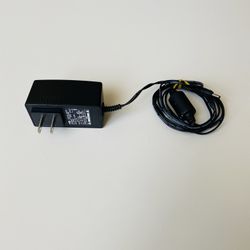 AcBel Switching Adapter. Technicolor. DCI105COM. Model: WA9003. Input: 100-120V. 50-60Hz. Max 0.2A. Output: 5V. 1.5A. New. Never used.